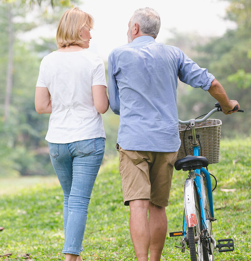 Active seniors like these two walking and riding their bikes need chiropractic care for seniors to stay active and free from pain.